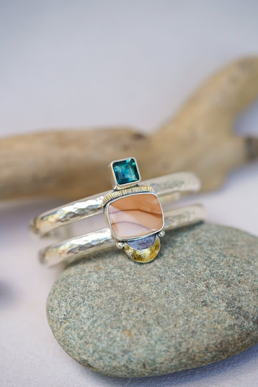 statement cuff with jasper and blue fluorite on a river rock