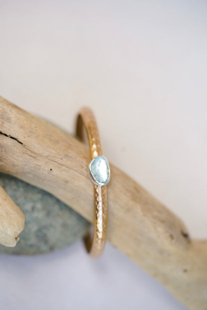 gold stamped cuff with aquamarine